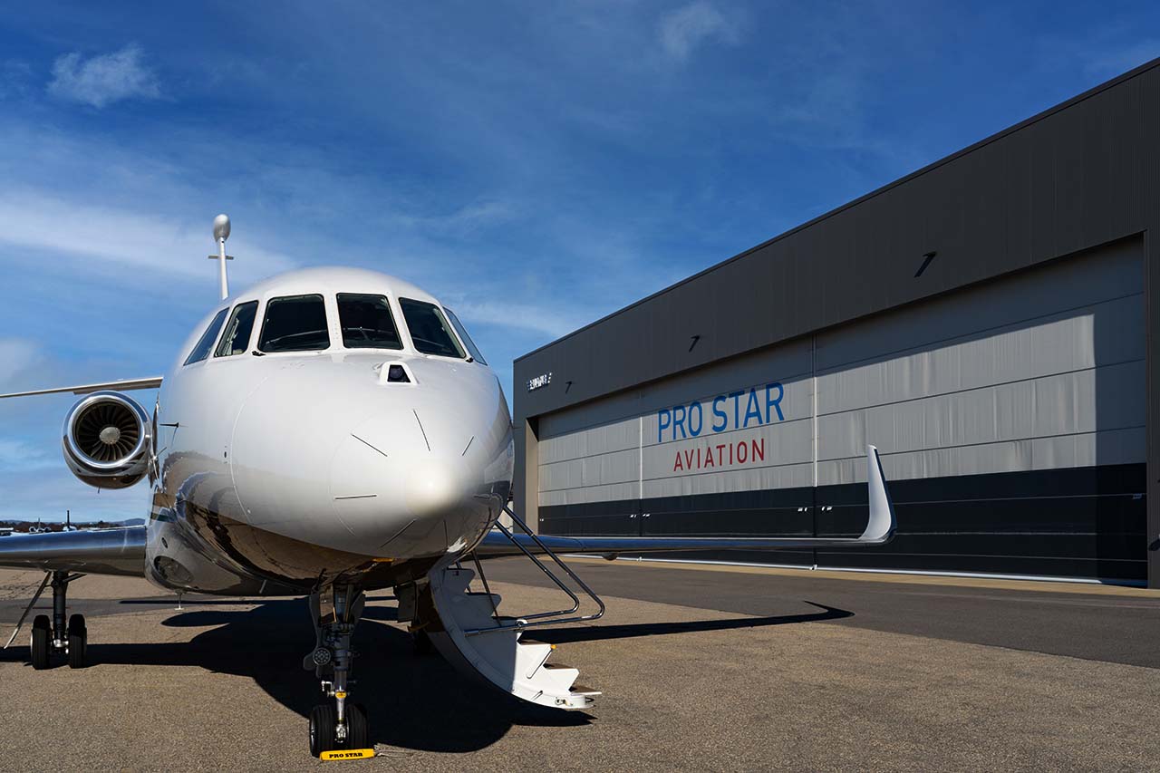 Falcon 2000 in front of hangar